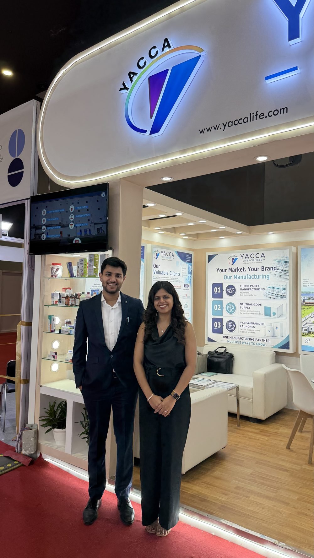 Yacca Lifesciences team members at the booth entrance
