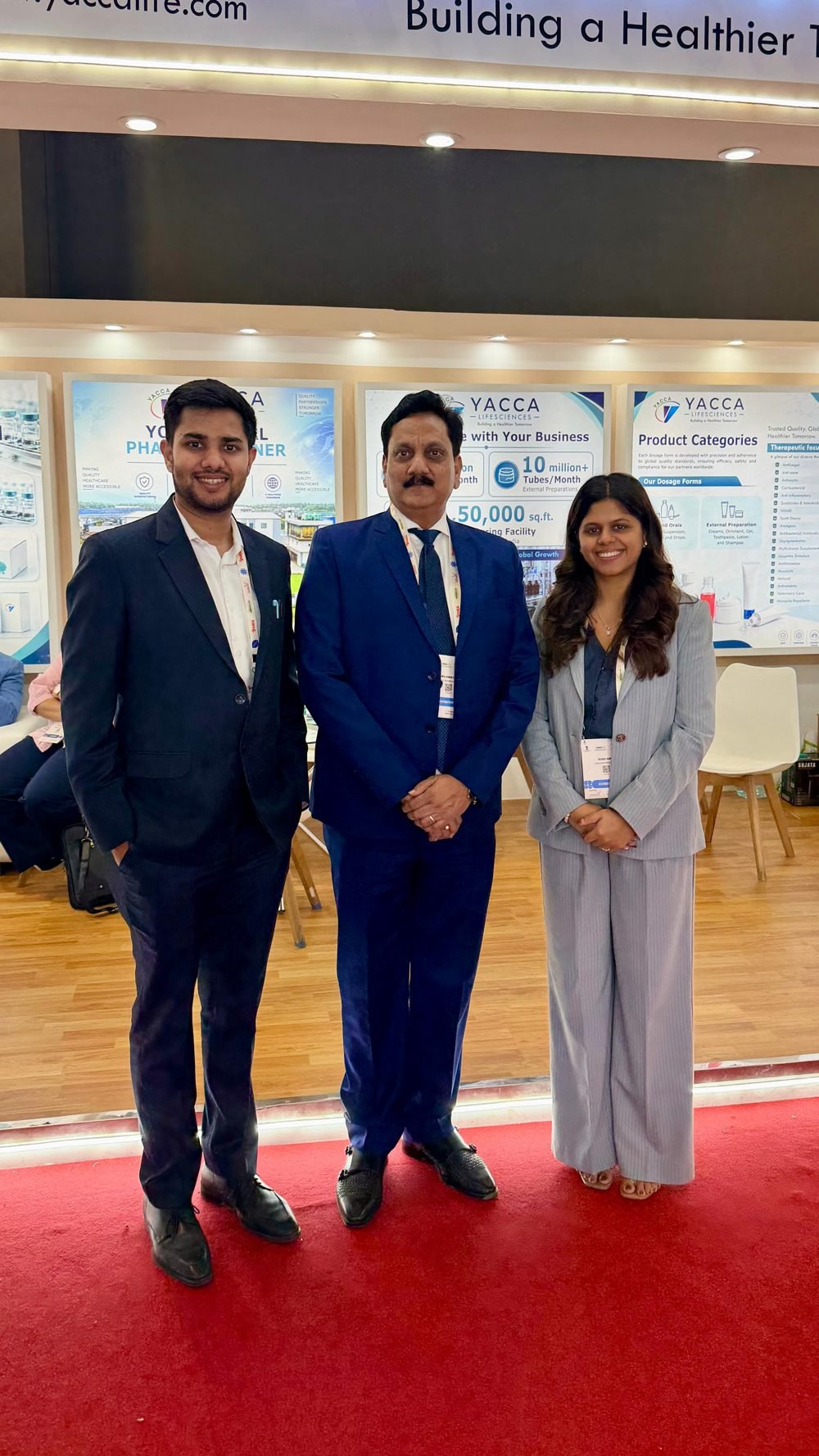 Yacca Lifesciences team beside the strengths and product category displays