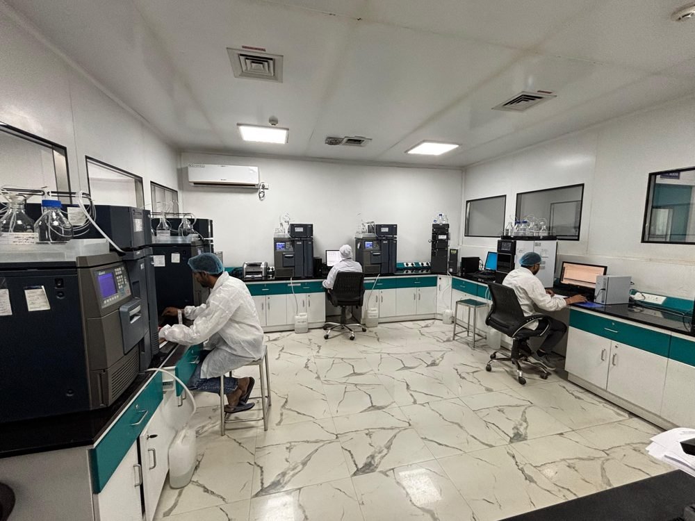 Yacca Lifesciences in-house QA/QC laboratory with analysts operating HPLC instruments
